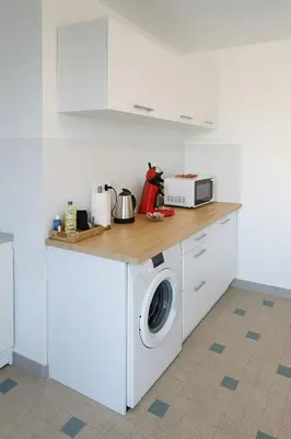 Cuisine ou kitchenette dans l'établissement Grand appartement 3 chambres Wifi & Parking