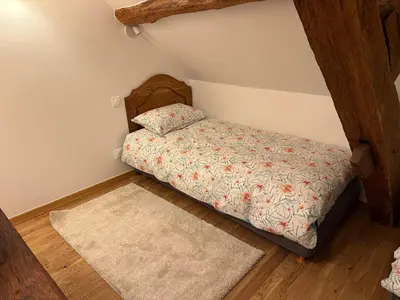 Un ou plusieurs lits dans un hébergement de l'établissement Auberge du Vieux Brancion