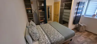 Un ou plusieurs lits dans un hébergement de l'établissement Le petit cocon de Céline et Jérémy