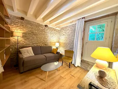 Coin salon dans l'établissement Clos de Fougères - Duplex Les Fleurières