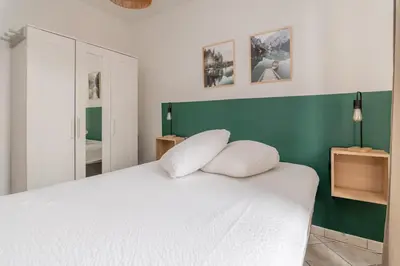 Un ou plusieurs lits dans un hébergement de l'établissement Appartement proche gare