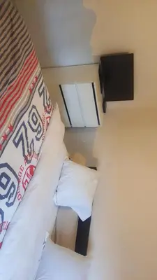 Un ou plusieurs lits dans un hébergement de l'établissement Joli appartement de 2 chambres au centre-ville
