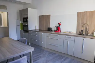 Cuisine ou kitchenette dans l'établissement Les Haussmanniens