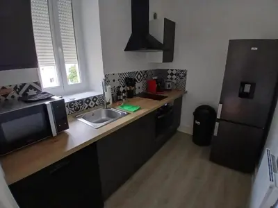 Cuisine ou kitchenette dans l'établissement Charmant appartement avec décoration moderne
