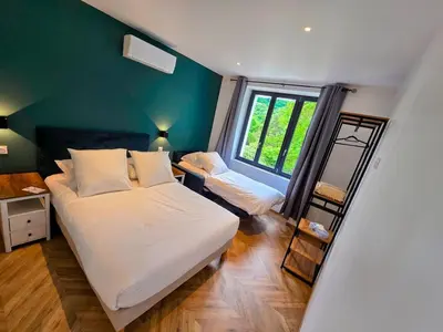 Un ou plusieurs lits dans un hébergement de l'établissement L'appartement 6 by Vindihouses