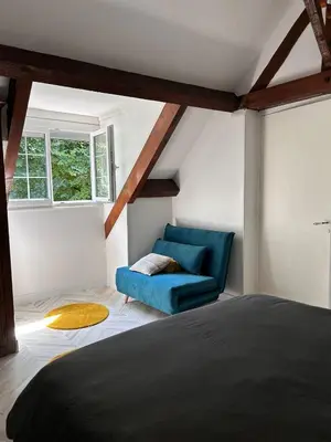 Un ou plusieurs lits dans un hébergement de l'établissement Maison aux portes de Dijon à la campagne