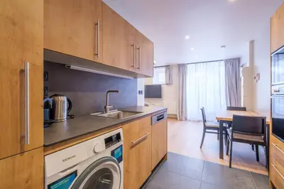 Cuisine ou kitchenette dans l'établissement Résidence le 16 - Centre Ville