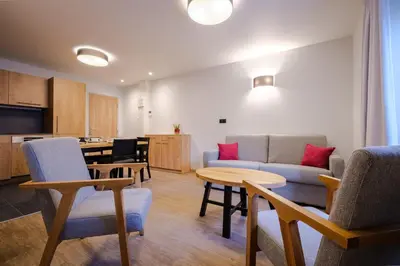 Coin salon dans l'établissement Résidence le 16 - Centre Ville