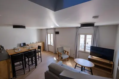 Coin salon dans l'établissement Résidence le 16 - Centre Ville