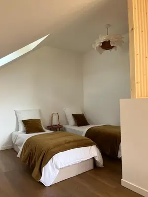 Un ou plusieurs lits dans un hébergement de l'établissement HÔME Les hauts du Val