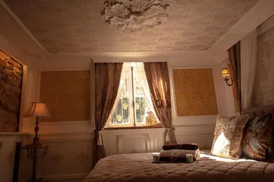 Un ou plusieurs lits dans un hébergement de l'établissement Au Petit Chateau les Bains a Thermen Morvan