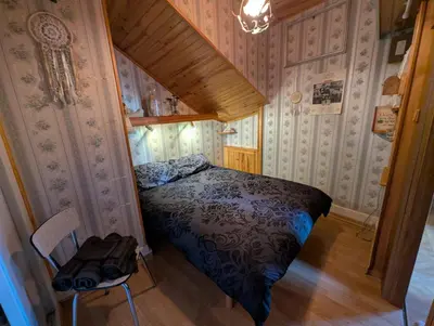 Un ou plusieurs lits dans un hébergement de l'établissement La chambre du temps - Appartement Escape game