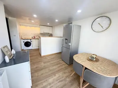 Cuisine ou kitchenette dans l'établissement Appart cocooning terrasse