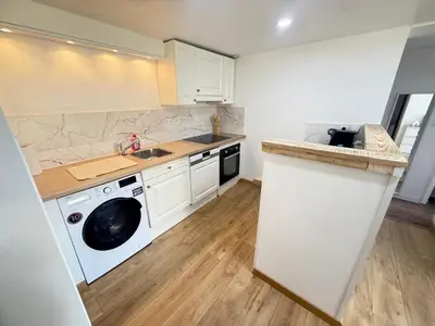 Cuisine ou kitchenette dans l'établissement Appart cocooning terrasse