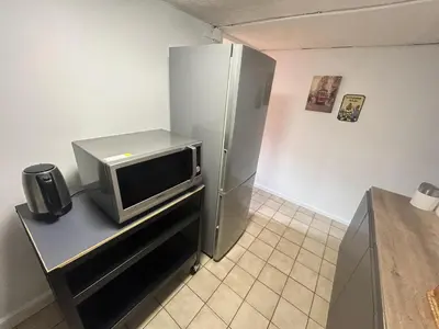 Cuisine ou kitchenette dans l'établissement Chambre au calme parc de la colombière