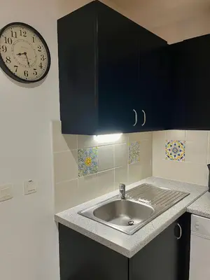 Cuisine ou kitchenette dans l'établissement Appartement détente, piscine - sauna - vue sur le golf