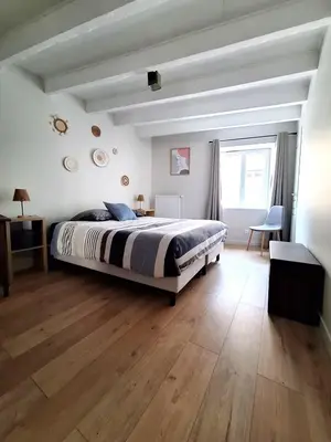 Un ou plusieurs lits dans un hébergement de l'établissement Maison familiale cosy & nature, Charolais