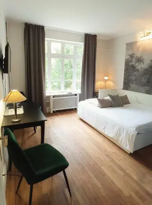 Un ou plusieurs lits dans un hébergement de l'établissement Suite studio Darcy