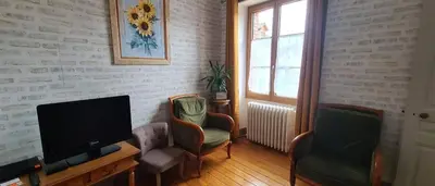 Coin salon dans l'établissement Ô Loue Rétro - 6 personnes - 1er étage