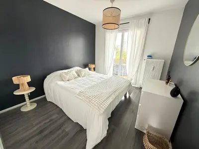 Un ou plusieurs lits dans un hébergement de l'établissement Spacieux appartement - 5min du centre ville