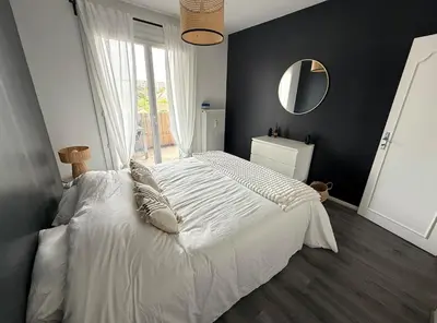 Un ou plusieurs lits dans un hébergement de l'établissement Spacieux appartement - 5min du centre ville