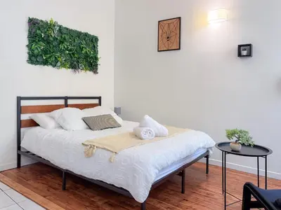 Un ou plusieurs lits dans un hébergement de l'établissement Cozy studio