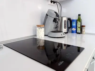 Cuisine ou kitchenette dans l'établissement Cozy studio