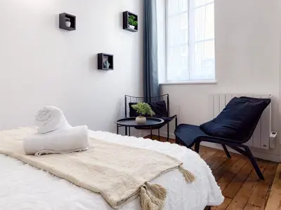 Un ou plusieurs lits dans un hébergement de l'établissement Cozy studio
