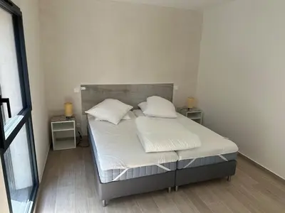 Un ou plusieurs lits dans un hébergement de l'établissement Appartement indépendant jusqu'à 10 personnes