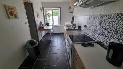 Cuisine ou kitchenette dans l'établissement Champvans centre - Appartement calme et tout confort en plein centre du village
