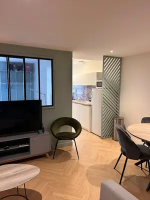 Télévision ou salle de divertissement dans l'établissement Le scandinave