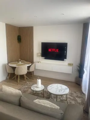 Coin salon dans l'établissement Appartement Jacuzzi proche Cité Gastronomique