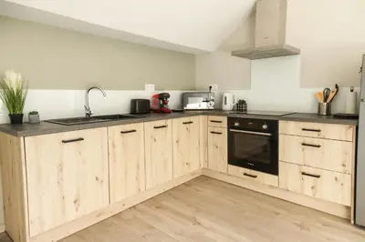 Cuisine ou kitchenette dans l'établissement L'appart 1952 - Proxi ciné et port - Parking
