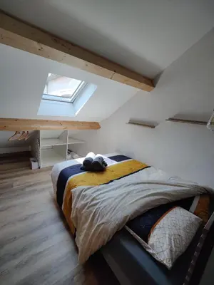 Un ou plusieurs lits dans un hébergement de l'établissement Ateliers des rêves - climatisé, Dijon centre