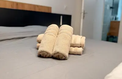 Un ou plusieurs lits dans un hébergement de l'établissement Elégant et Calme au cœur du Centre-ville