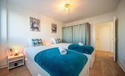 Un ou plusieurs lits dans un hébergement de l'établissement Home SWEET HOME