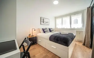 Un ou plusieurs lits dans un hébergement de l'établissement Home SWEET HOME