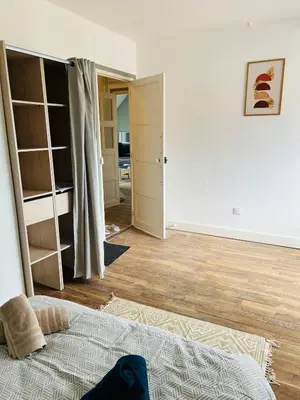 Un ou plusieurs lits dans un hébergement de l'établissement T3 moderne&jardin& garage&2 lits doubles& lit bébé