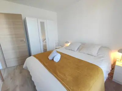 Un ou plusieurs lits dans un hébergement de l'établissement Duplex moderne, chaleureux au calme à Toison d'or