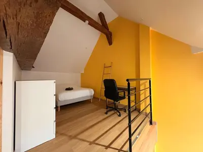 Un ou plusieurs lits dans un hébergement de l'établissement Le Relais - Appartement climatisé au coeur de Dijon
