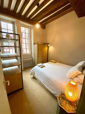 Un ou plusieurs lits dans un hébergement de l'établissement Le Verrerie with 2 bedrooms, Historic Center