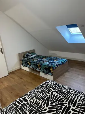 Un ou plusieurs lits dans un hébergement de l'établissement Appartement F2 de 55 m2