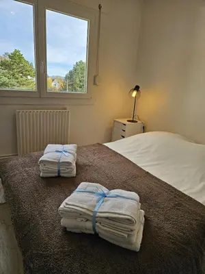 Un ou plusieurs lits dans un hébergement de l'établissement Appartement T2