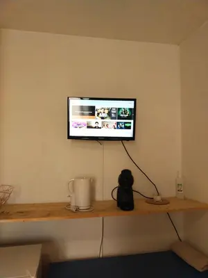 Télévision ou salle de divertissement dans l'établissement Studio proche gare et cité gastronomique