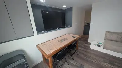 Coin salon dans l'établissement Appartement charmant à Charnay-lès-Mâcon avec jardin