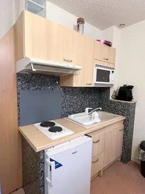 Cuisine ou kitchenette dans l'établissement le primo - Château - Ville