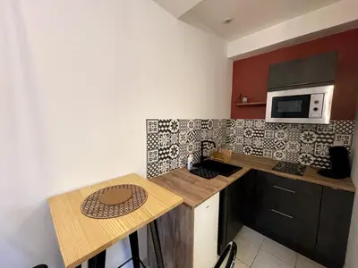 Cuisine ou kitchenette dans l'établissement Le Théâtre 3