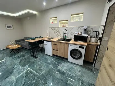 Cuisine ou kitchenette dans l'établissement Cocoon Hyper Center