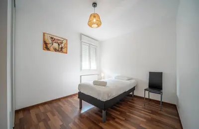 Un ou plusieurs lits dans un hébergement de l'établissement Spacieux logement près de Chalon