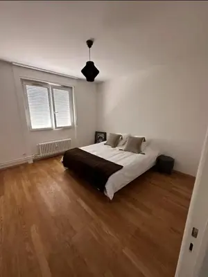 Un ou plusieurs lits dans un hébergement de l'établissement Appartement spacieux